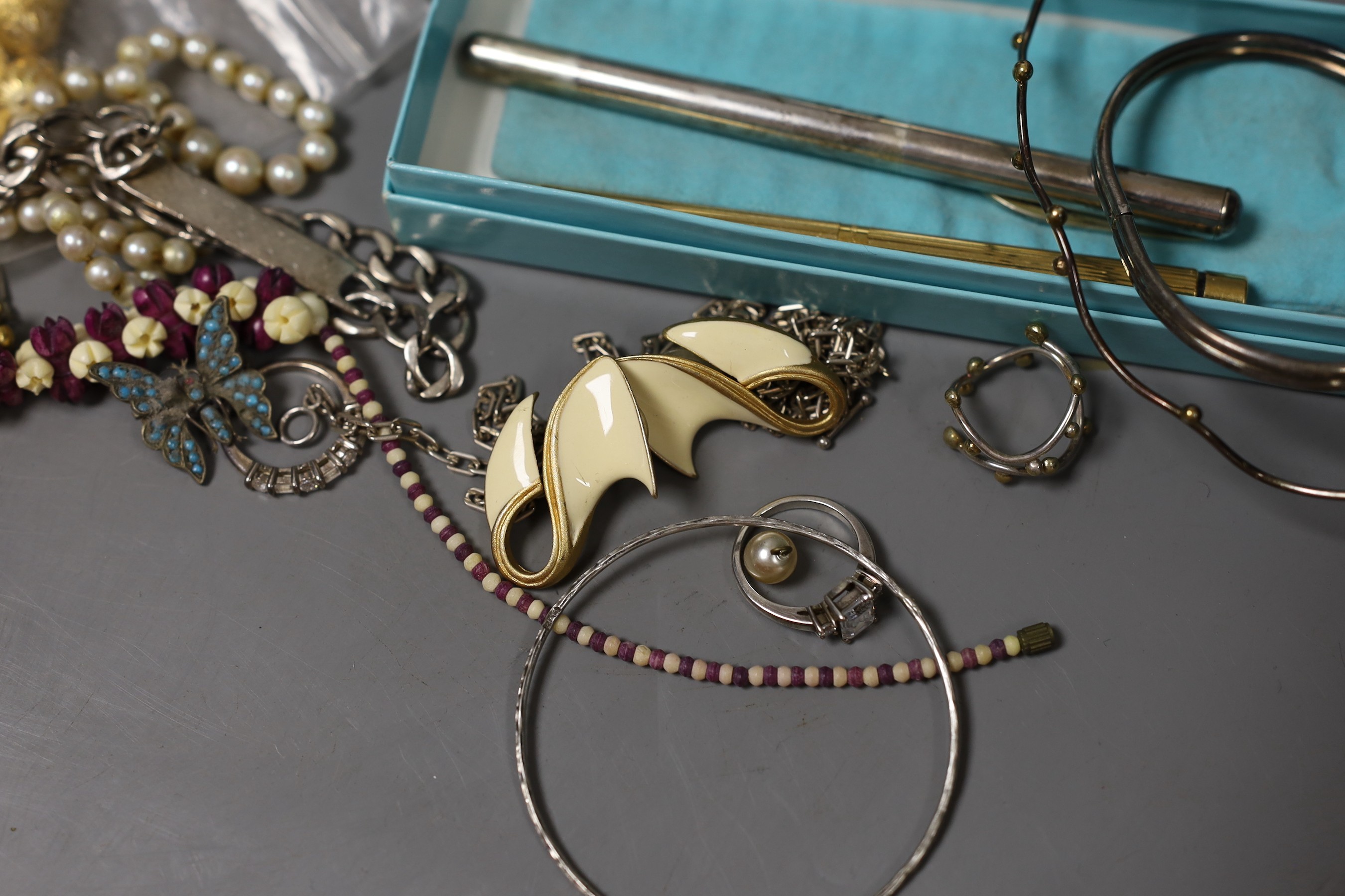 Mixed costume jewellery including filigree bracelet, bangles etc. and other items including two pens and a fob watch.